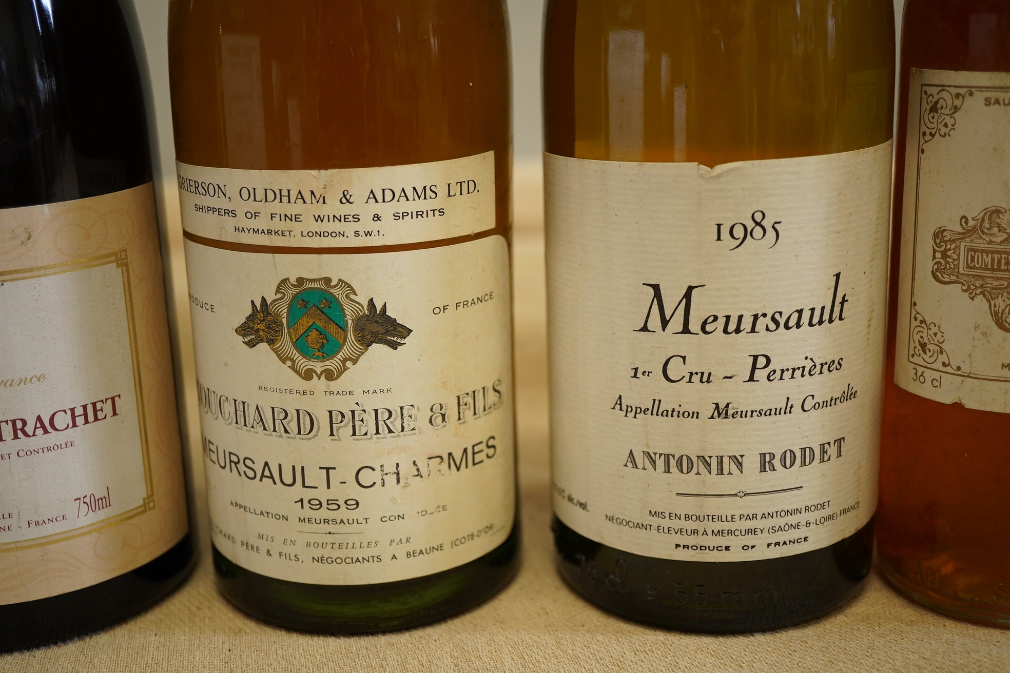 One bottle of 1985 Meursault 1er Cru, Antonin Rodet, one bottle of 2001 Batard Montrachet, two bottles of 1959 Meursault Charmes, Bouchard Pere & Fils and one half bottle of 1973 Chateau Filot, Sauternes. (5)